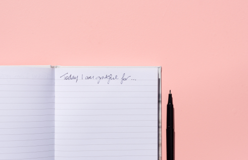 A notebook with the text, "Today I am grateful for"
