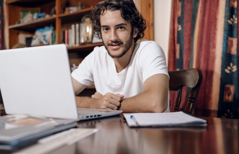 CDU student Nicholas studying laptop online