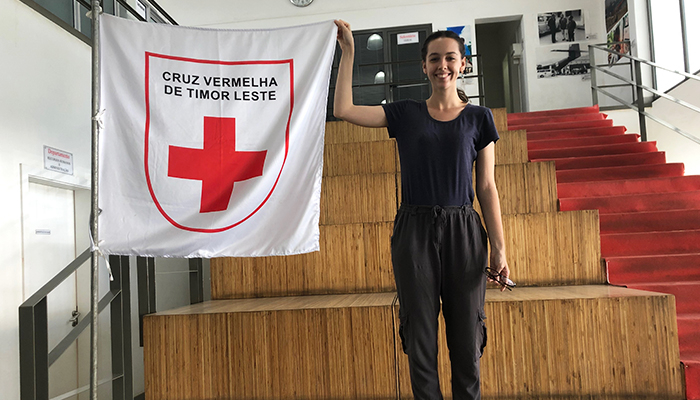 CDU student Stephanie von Kanel holds up a flag