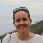 Jamie Payne head and shoulders with railing and ocean in background