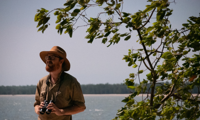 Researcher Alex Carey conducting fieldwork