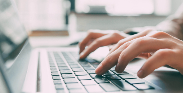 Person typing on a computer