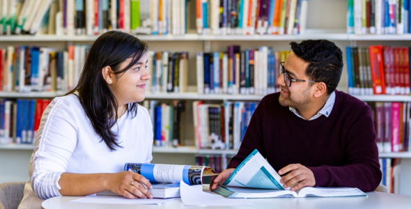 Ashweeta and friend in the library