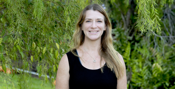 Dr Jo Randall, head and shoulders with green leaves in background