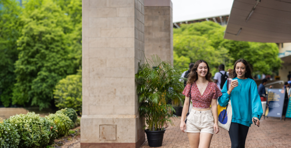 Alicia and friend on campus