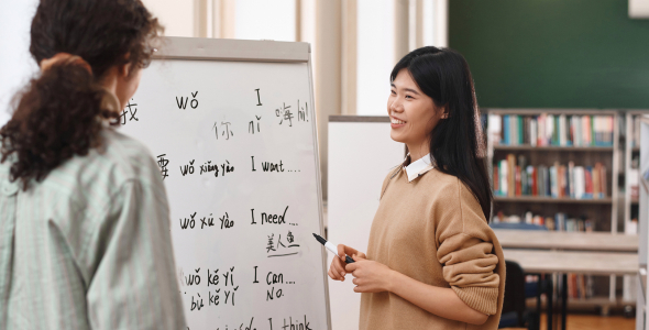 Chinese language teacher with student