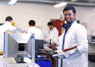 Engineering student in lab coat