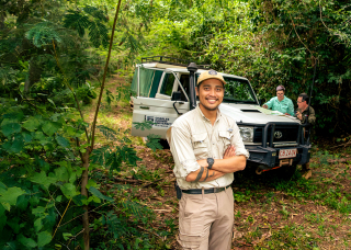 Group of people standing near a 4WD vehicle