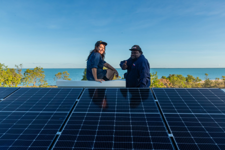 : Scott McDinny and Lauren Mellor installing solar at Mumathumburru (West Island). Credit: Rachel Mounsey.