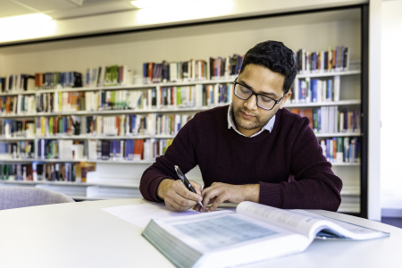 CDU Student in library