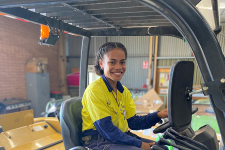 female apprentice sitting in equipment