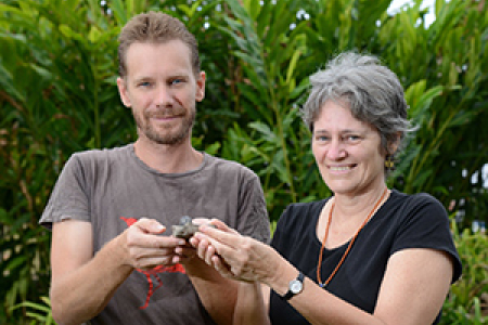 Senior Research Fellow Dr Bronwyn Myers holds samples of manganese ore from Kupang with Research Fellow Rohan Fisher