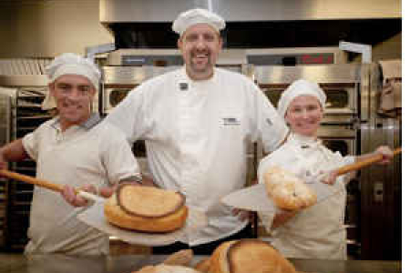 Apprentice bakers Chris Field and Deborah Trebilcock with CDU Bakery Facilitator Robert Schwerdt (centre)