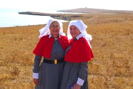 CDU Nursing Museum curator Janie Mason (left) and Julie Lloyd at the re-enactment last year of the arrival of the Anzac nurses at Lemnos Island