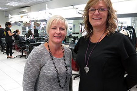 Hairdressing Team Leader Linda Manning and trainer Joanne Scott at CDU's Alice Springs salon ... proud of hairdressing team's industry accolade.