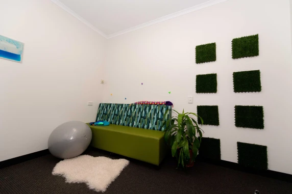 a bench in the corner with a yoga ball