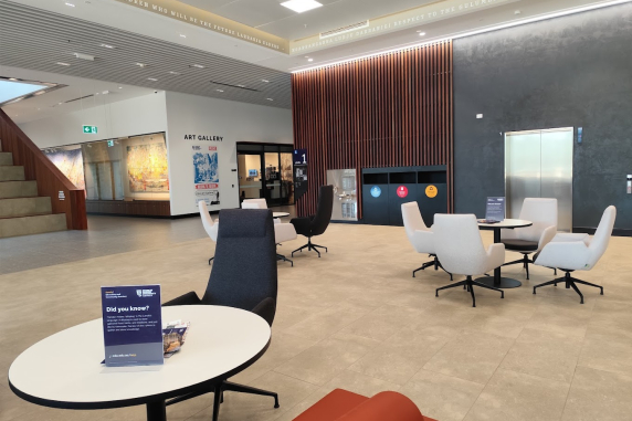 Danala Foyer with tables and chairs, lift access and the Art Gallery