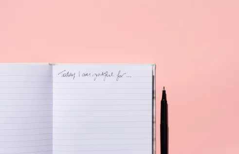 A notebook with the text, "Today I am grateful for"