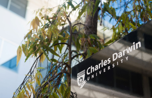 Charles Darwin University sign surrounded by leaves