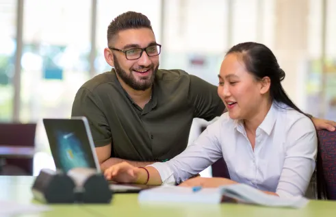 CDU International Student in the library