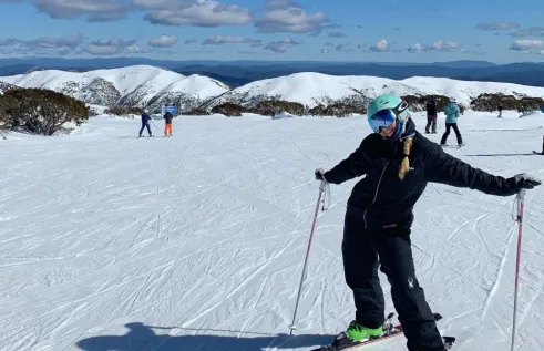 Teaching student Maddy on the slopes