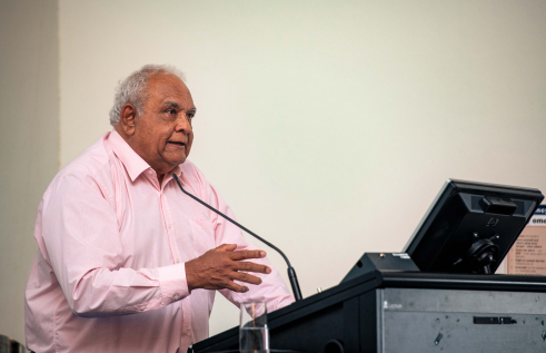Person speaking at a public lecture