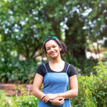 Genevieve smilling in a garden