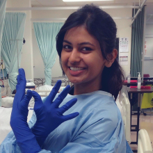 ishita in medical scrubs and gloves