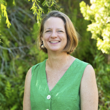 Pia Harkness head and shoulders with plants in the background