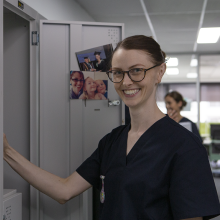 CDU nursing student at her locker in a hospital
