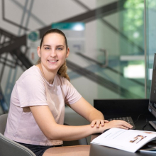 CDU student Zoe White sitting at a computer the Waterfront campus