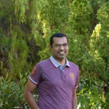 Dr Salman Quddus with green leafy background