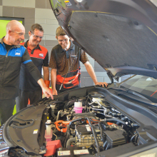 Former CDU student and The Dent Pusher Director David Eves and Prompt Auto Repairs Director Scott Petschel complete training with MTA training assessor Steve Richardson at CDU as part of a new hybrid vehicle training course held at the Casuarina campus.