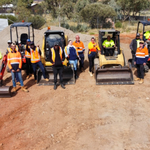 students standing with machinery