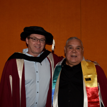 two male researchers pose for camera