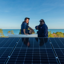 : Scott McDinny and Lauren Mellor installing solar at Mumathumburru (West Island). Credit: Rachel Mounsey.