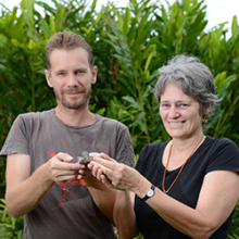 Senior Research Fellow Dr Bronwyn Myers holds samples of manganese ore from Kupang with Research Fellow Rohan Fisher