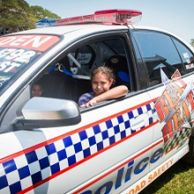 Amelia Kadiba checks out the “Beat the Heat” road safety police racing car at last year's CDU Open Day