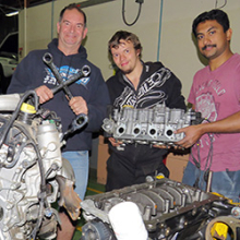 Automotive lecturer Rob Tucker with flying spanners competitors Alex Riley and Eldhose Thomas
