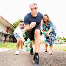 CDU Student Association  Secretary Ali Dhirani and Psychology lecturer Carmen Cubillo help CDU’s Daniel Gahreman (centre) prepare for the fun run