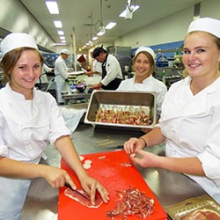 Kitchen operations students Johanna Ezard, Anina Conradie and Suzi Nitschke prepare scallop prosciutto “lollipops” for the degustation menu.