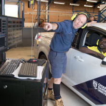 Automotive lecturer Mark James (left) and student Terrence Bismark check engine data from a ute on the new dynamometer, which will be on display at Open Day on Sunday, 20 August. Photo: Julianne Osborne